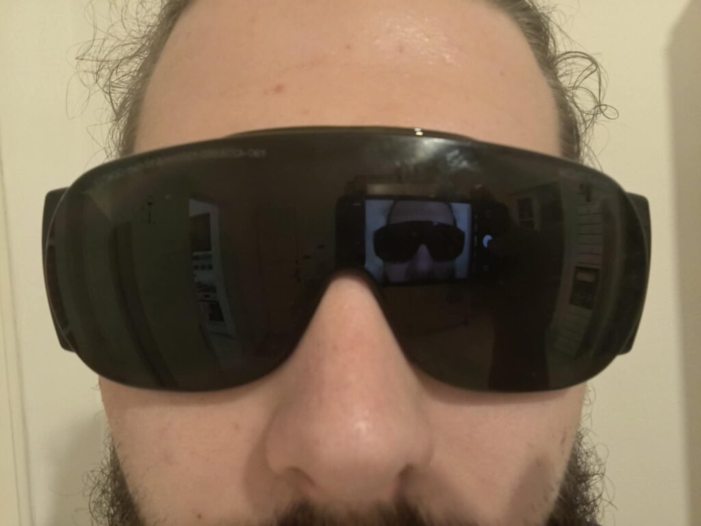 37c3f580-9580-4218-aefb-ec71a6b506a1 man in green protective glasses