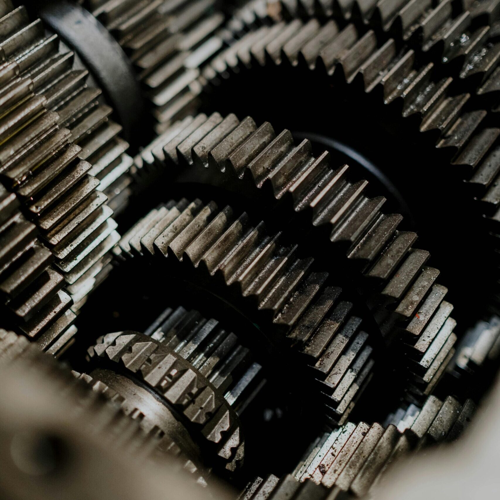Detailed close-up of metal gears inside a machine showcasing precision engineering.