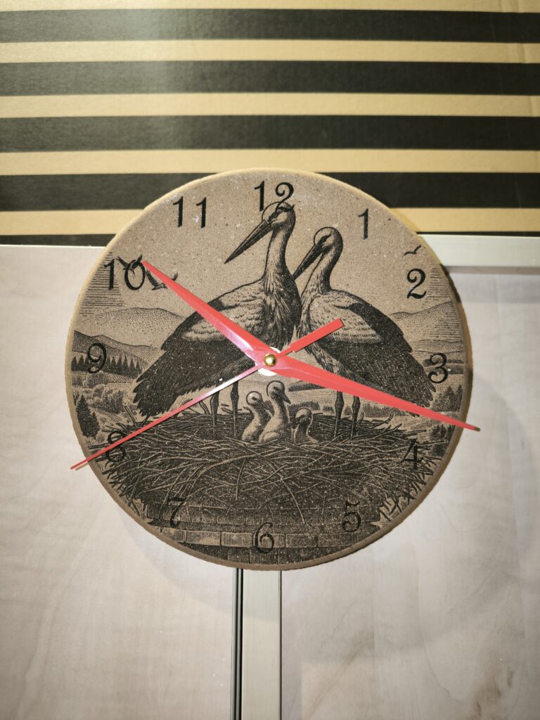 cork clock with engraved storks